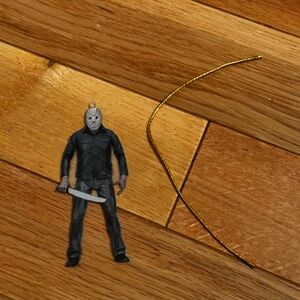 Jason Inspired Ornament. It comes with a gold tie to hang.